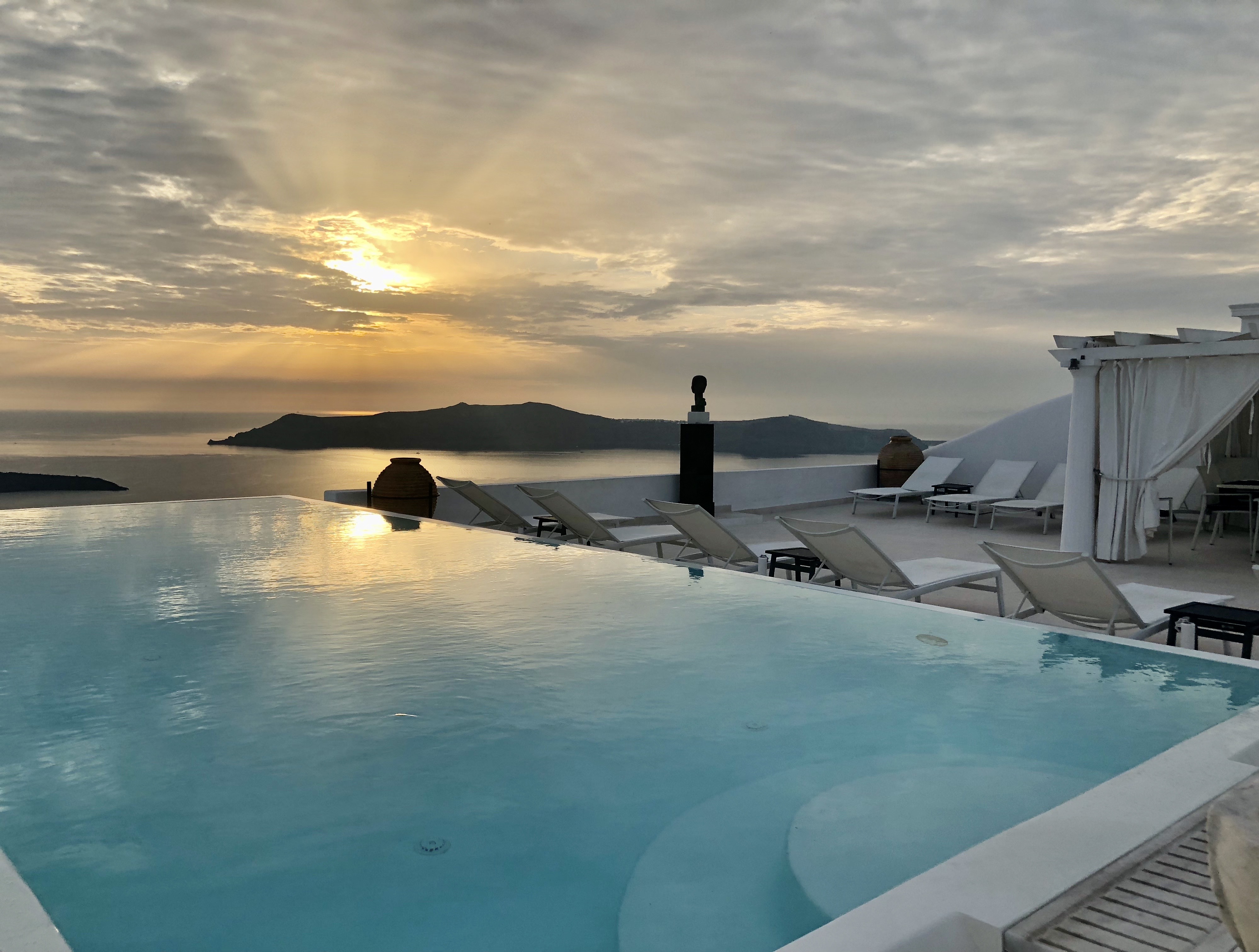 Santorini sunset pool view gluten free joy tours